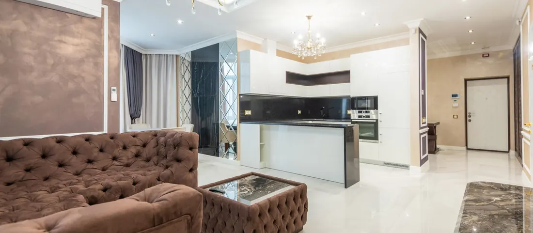 Open plan living room and kitchen with clear polished floors